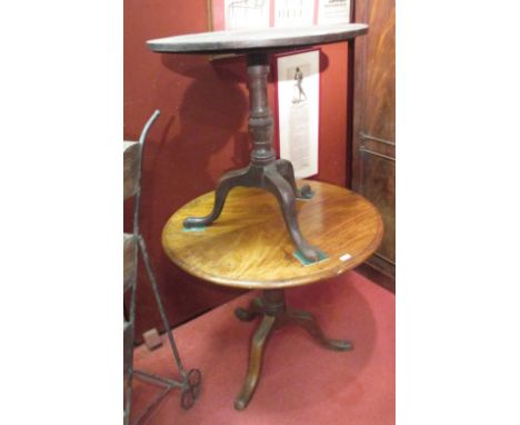 A George III mahogany tripod table together with another (2)  