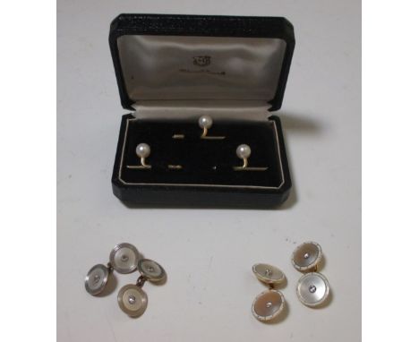 A pair of mother of pearl and diamond cufflinks stamped 18ct, cased, together with another pair of mother of pearl cufflinks 