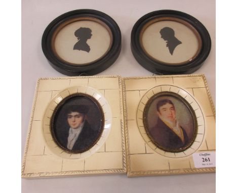 A pair of silhouettes of a Gentleman and Lady in profile, in circular frames; together with a pair of facsimile portrait mini