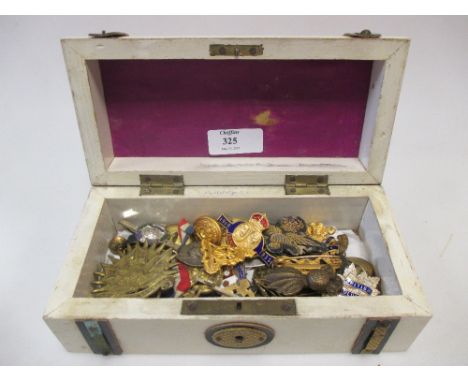 A collection of enamel and military badges  