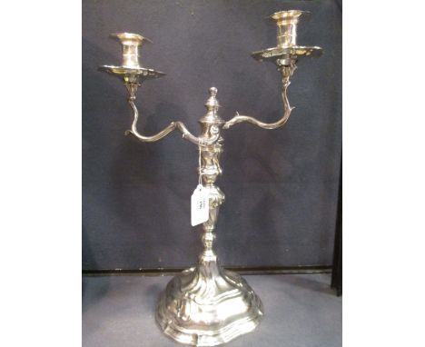 A continental white metal twin light candelabrum, 37.5cm high  