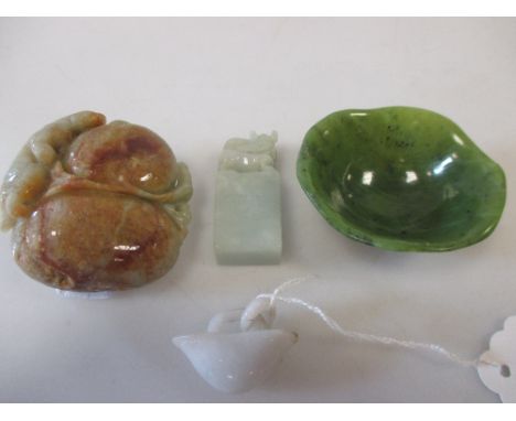 Four jade carvings; a peach, a dragon topped seal, a bowl and another (4)  