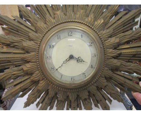 A sunburst wall clock  