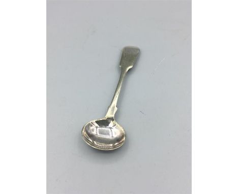 A silver mustard spoon