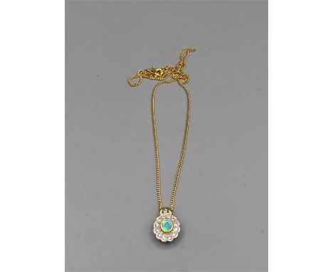 An opal and diamond pendant on an 18ct gold chain