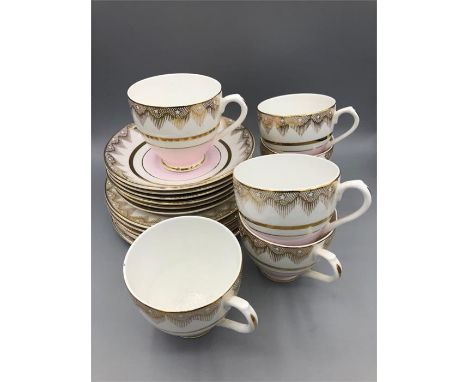 Imperial pale pink and embossed with 22ct gold six tea cups and saucers along with six side plates.