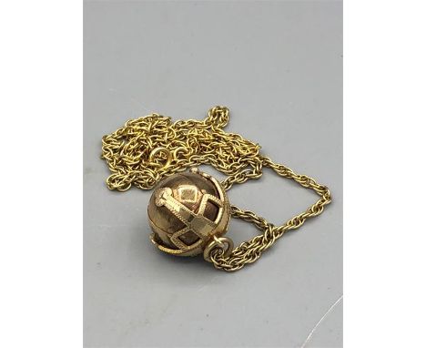 A Masonic gold orb on a 9ct gold chain (20g)
