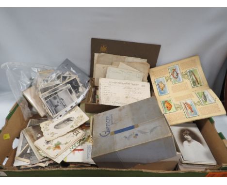 A box of antique and vintage photographs etc
