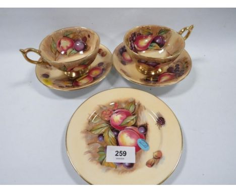Two Aynsley Orchard Gold cups and saucers together with a similar side plate
