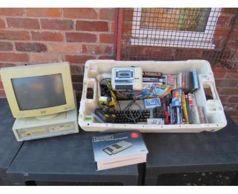 A Commodore  64 computer system together with a large selection of computer games, manuals, joysticks, plus a vintage Amstrad