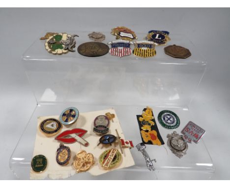 A collection of enamel badges