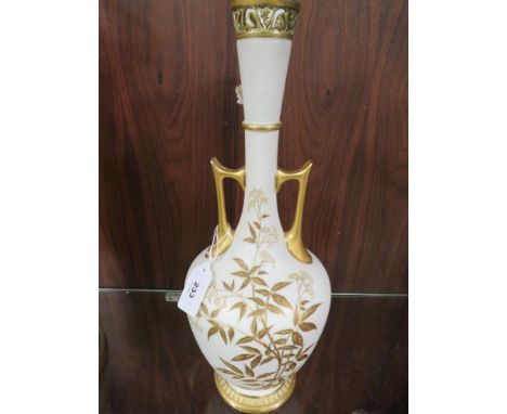 A pierced tall twin handled blush ivory Royal Worcester vase decorated with blackberries and elderflower -loss of gilding to 