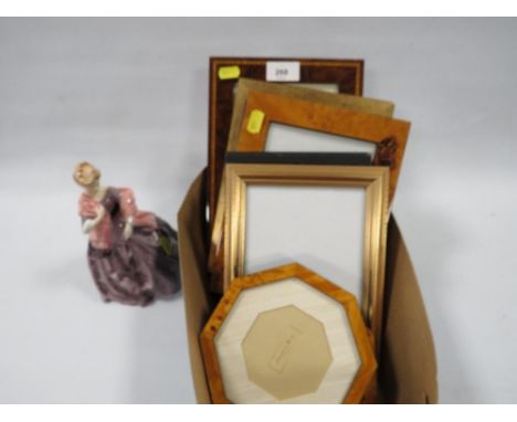 A Royal Worcester figurine "First Dance" together with a small tray of modern picture frames