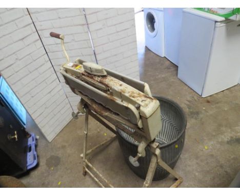 An ACME vintage mangle and a galvanised wash tub