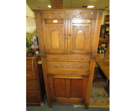 An oak carved drinks cabinet - W 70 cm