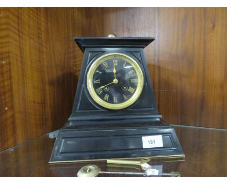 A Victorian Egyptian style black slate mantle clock with an 8 day Japy bell strike movement with key