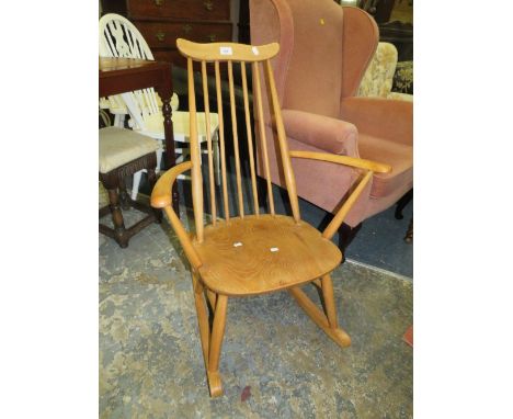 An Ercol blonde oak rocking chair