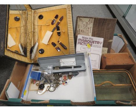 A tray of assorted collectables to include enamel buttons and badges etc