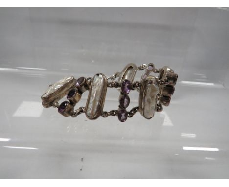 An amethyst and mother of pearl silver bracelet