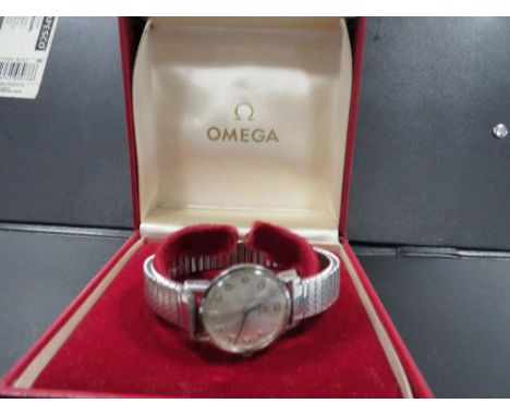 Omega - a vintage wrist watch on expandable steel bracelet in original box Dia 2.5cm