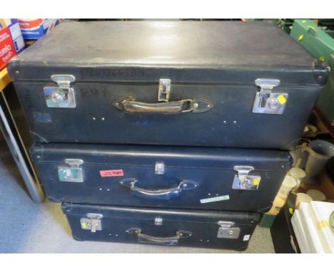 Three vintage globe trotter suitcases