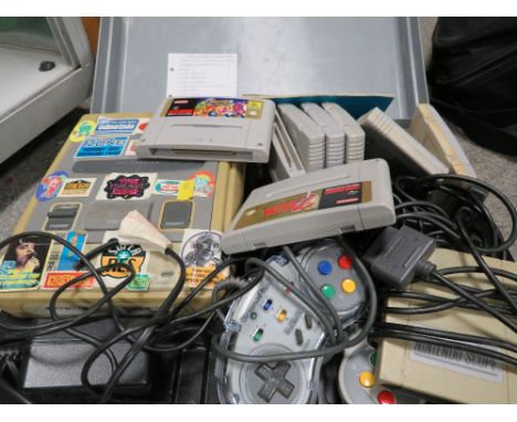 A cased Nintendo super NES console game and controllers (unchecked)