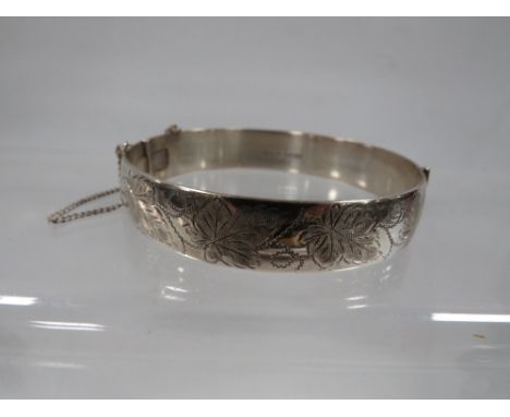 A hallmarked silver engraved bangle approx. weight 37.5g