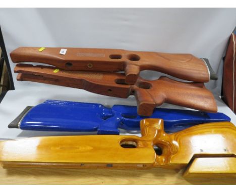 Four crossbow type wooden stocks