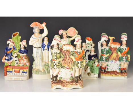 Six 19thC Staffordshire flatback and spill vase figures including The Rocket, tallest 28cm