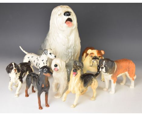 Beswick dog figures including fireside Old English Sheepdog, matt St Bernard, bulldog and Dalmatian and Doulton Old English S