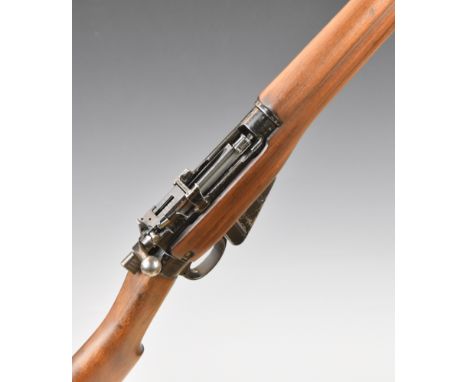 Short Magazine Lee Enfield (SMLE) No 4 Mk 1 .303 bolt-action rifle with storage compartment to the brass butt plate, adjustab