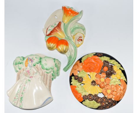 Clarice Cliff for Newport Pottery two Art Deco wall pockets and a plaque, tallest 26cm