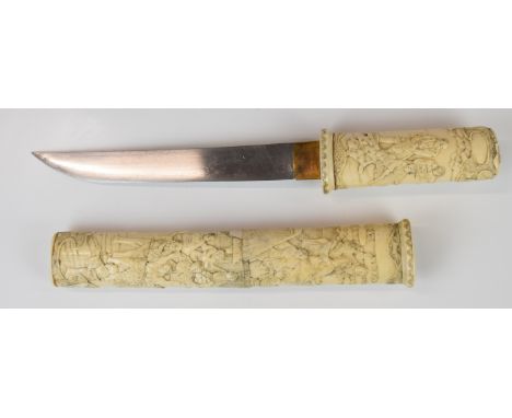 Japanese Meiji period Wakizashi Samurai sword with heavily carved bone handle and scabbard decorated with figural scenes and 