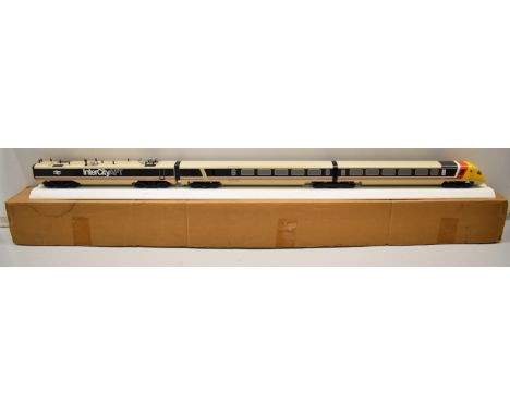 InterCity APT travel agent's display model of three carriages of the APT, on white track base, with label to end for Space Mo
