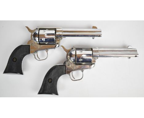 A pair of JMC Model 1874 Colt Army style blank or cap firing six-shot single action revolvers, each with chequered composite 