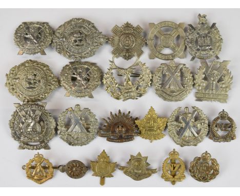 Twenty two Scottish Regiment and Commonwealth cap badges including Toronto Scottish, New Zealand Royal Air Force, Princess Pa