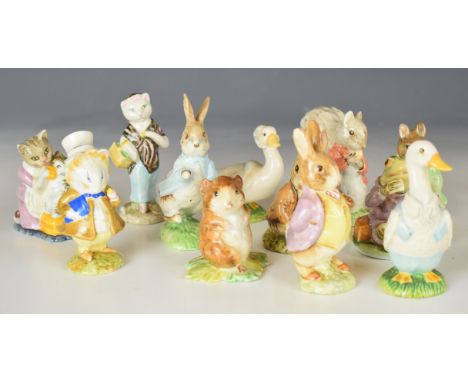 Twelve Beswick / Royal Albert Beatrix Potter figures including Susan and Amiable Guinea Pig