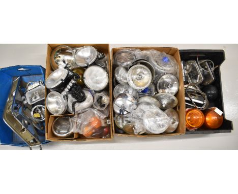 Large collection of headlamp, spot lamps and similar units including glass brake, side and indicator lenses, some by repute e