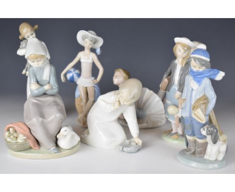 Eight Lladro child figures including girl with doll, ballerina, boy with puppy etc, tallest 22cm
