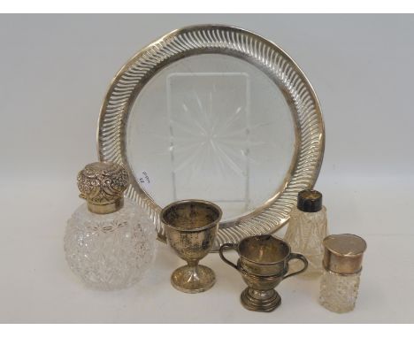 A silver and cut glass platter, Birmingham 1909, a silver topped cut glass scent bottle, a silver egg cup etc. 