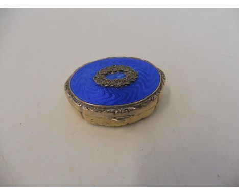 A silver and blue guilloche enamel lidded oval patch pot with lid mirrored to the inside.