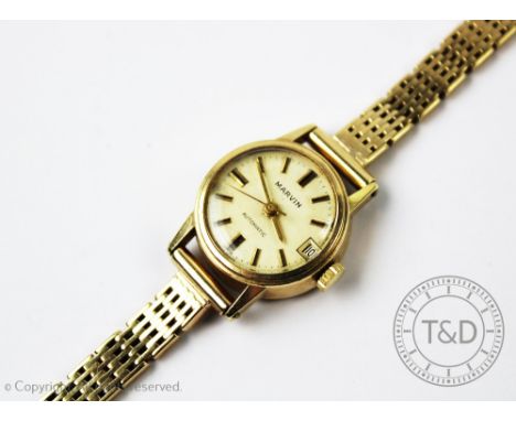 A ladies Marvin Automatic wristwatch, the champagne dial with batons, centre sweep seconds and subsidiary date dial, with an 