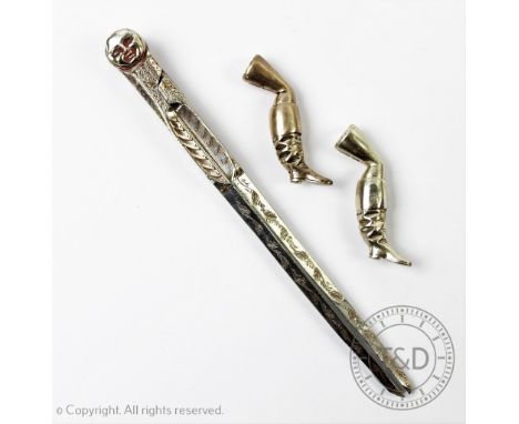 A pair of silver boot form pipe tampers, 'CAP' London 1981, 5cm long along with a silver plated protractor with moon face det
