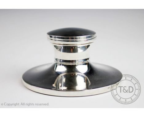A silver capstan inkwell, A J Poole Birmingham 2003, of typical plain polished design and enclosing clear glass liner, 6cm hi
