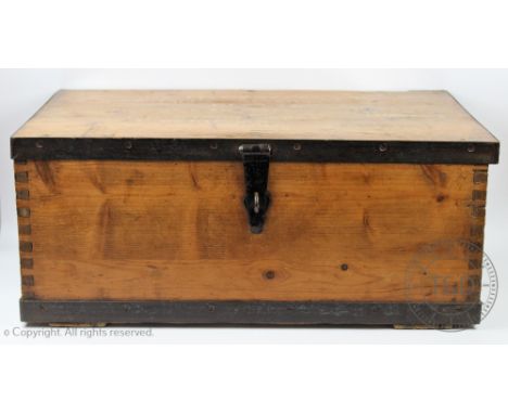 An early 20th Century wrought iron pine trunk of naval interest, the hinged cover with named top opening to reveal a vacant i