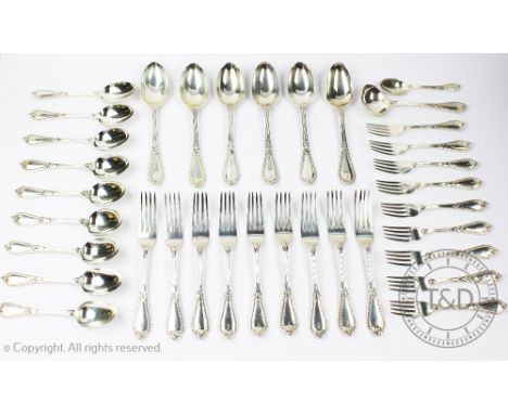 An assembled canteen of silver cutlery, with beaded and Gothic strap work detail, comprising; six serving spoons (2 x 1857, 2