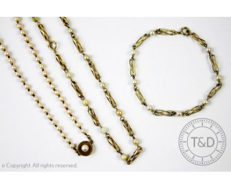 A yellow metal and cultured pearl set necklace and matching bracelet, each designed as openwork twist design links interspers