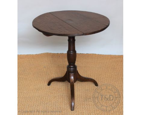 A George III oak occasional table, with three plank top, on a turned column and tripod base, 68cm H x 60cm diameter    CONDIT