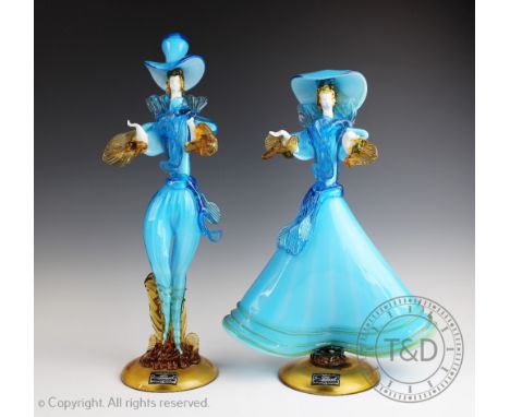 A pair of Murano glass figures, male and female companion in light blue and amber glass, 43c and 47cm high (2)