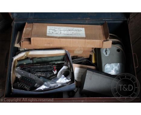 A metal trunk containing various train parts, boxes of kit models and various track (Qty)